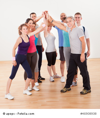 Healthy Friends High Fiving in Gym